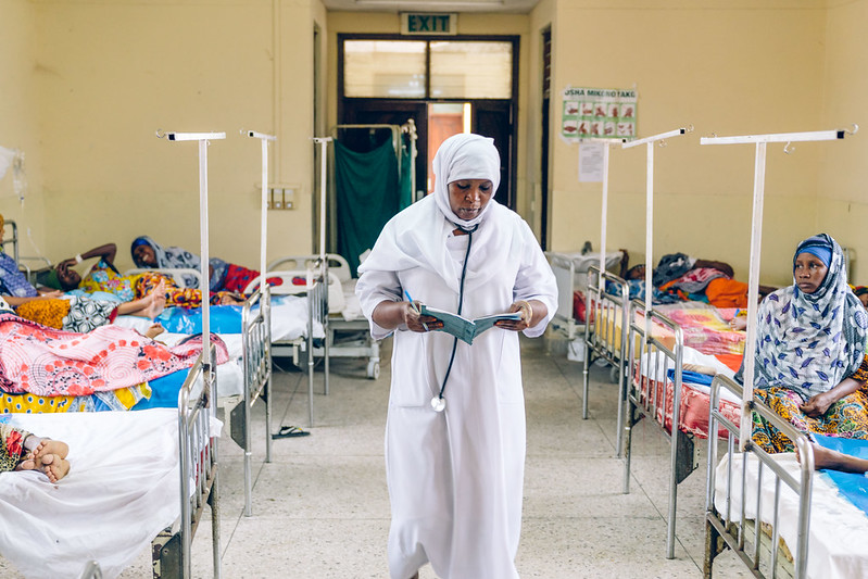 nurse walks hallway of maternity ward