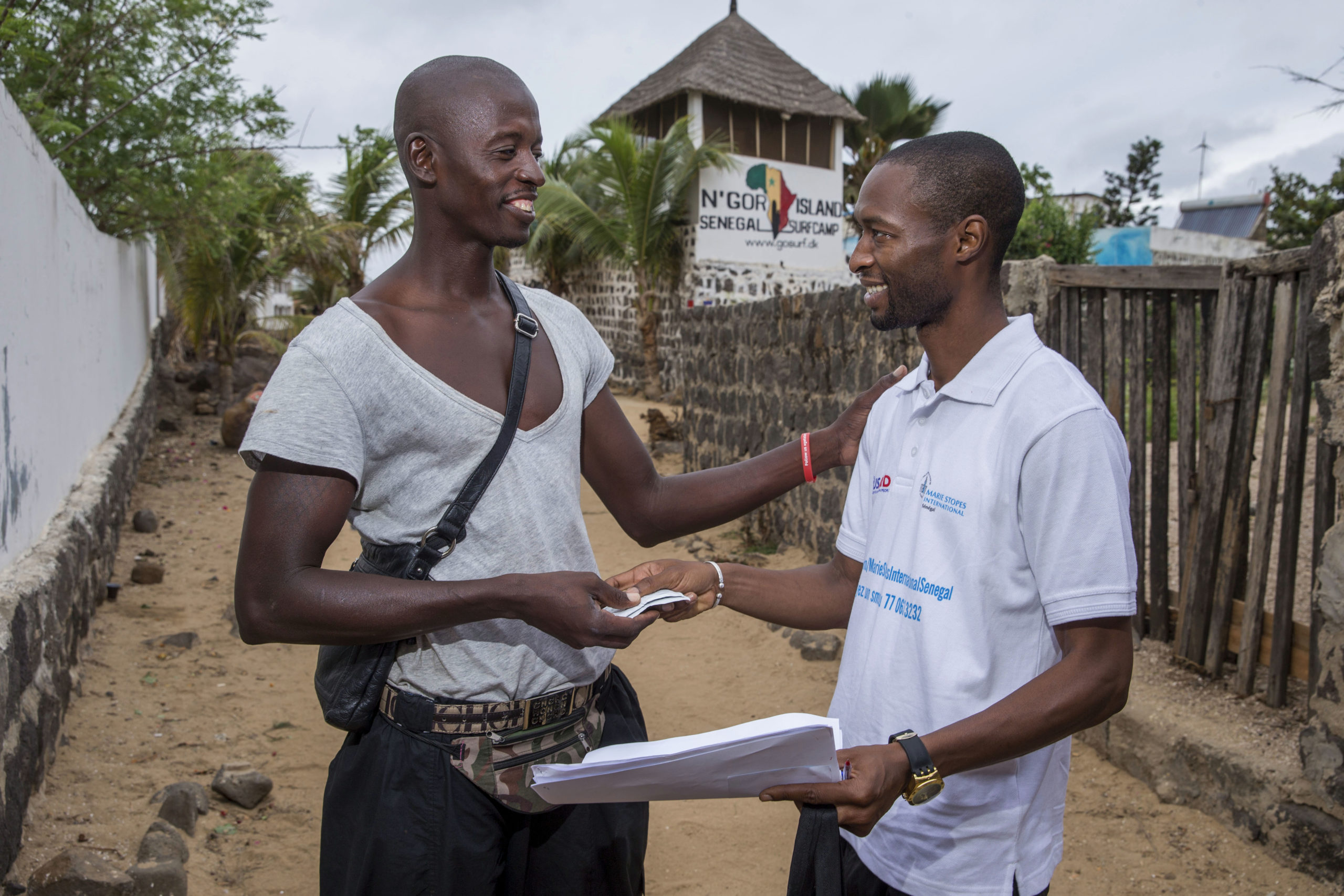 A youth outreach team from Marie Stopes International, a specialized sexual reproductive health and family planning organization on a site visit in N'gor Island in Dakar, Senegal, where they offer information to youth about sexual reproductive health services, and also distribute condoms.