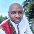 Picture of an African man in a white and red patterned shirt