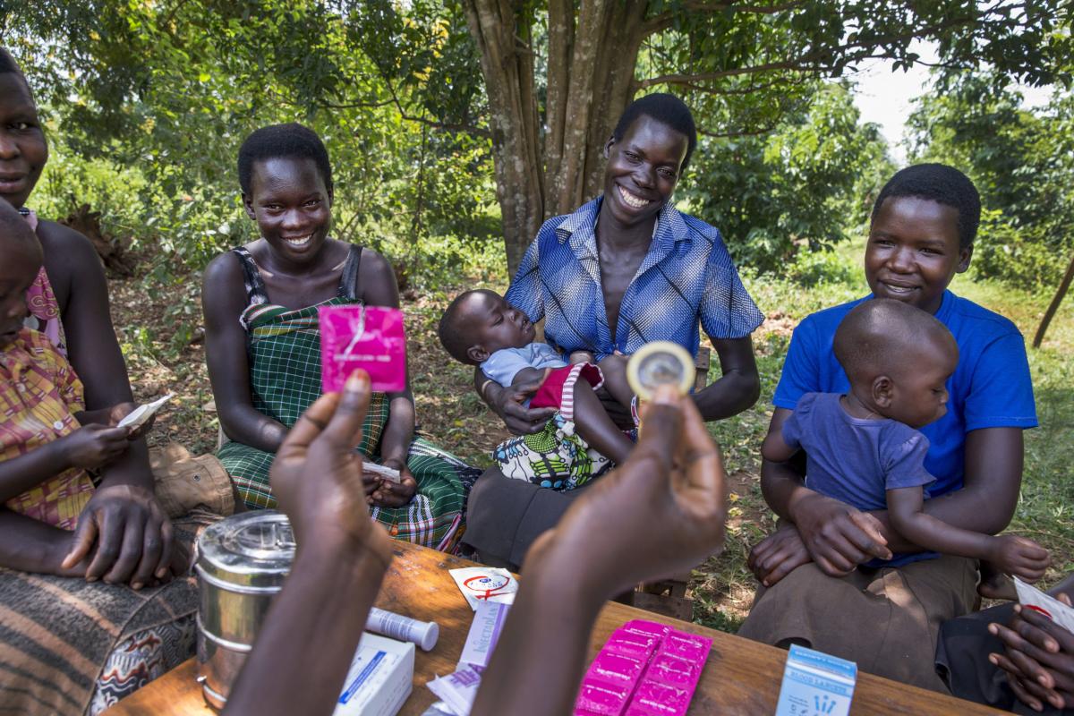 Women from the Young Mothers Group meeting and getting family planning information from a community health worker.